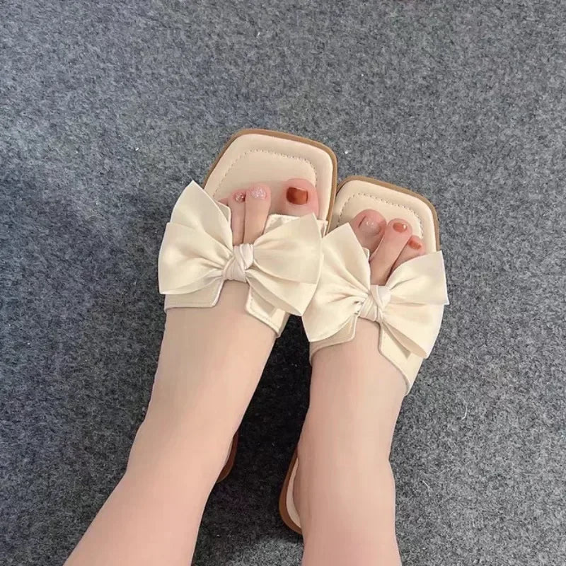Bow slippers female summer wear new fashionable sweet girl flat bottom non-slip fairy wind word cool slippers female
