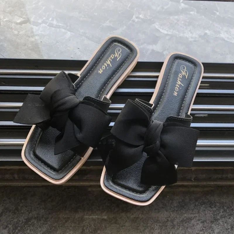 Bow slippers female summer wear new fashionable sweet girl flat bottom non-slip fairy wind word cool slippers female