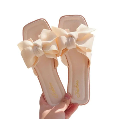 Bow slippers female summer wear new fashionable sweet girl flat bottom non-slip fairy wind word cool slippers female