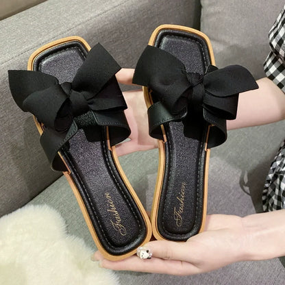 Bow slippers female summer wear new fashionable sweet girl flat bottom non-slip fairy wind word cool slippers female