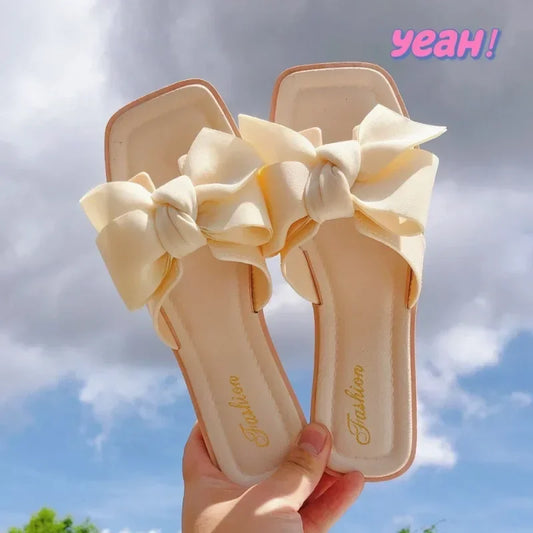 Bow slippers female summer wear new fashionable sweet girl flat bottom non-slip fairy wind word cool slippers female