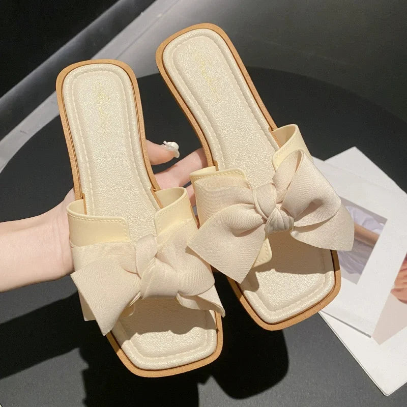 Bow slippers female summer wear new fashionable sweet girl flat bottom non-slip fairy wind word cool slippers female