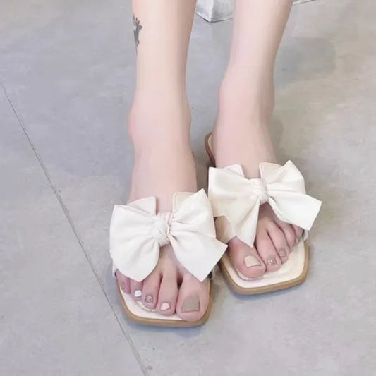 Bow slippers female summer wear new fashionable sweet girl flat bottom non-slip fairy wind word cool slippers female